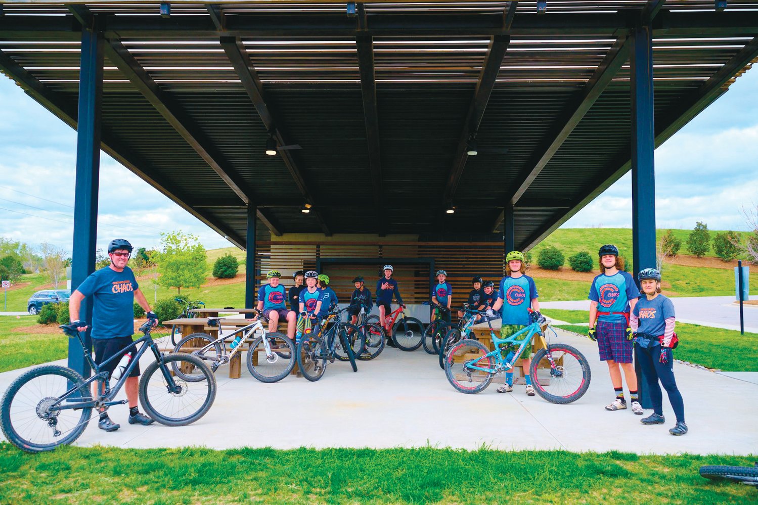 The Chatham County Chaos mountain biking team poses for a photo during a practice at Briar Chapel on April 9.